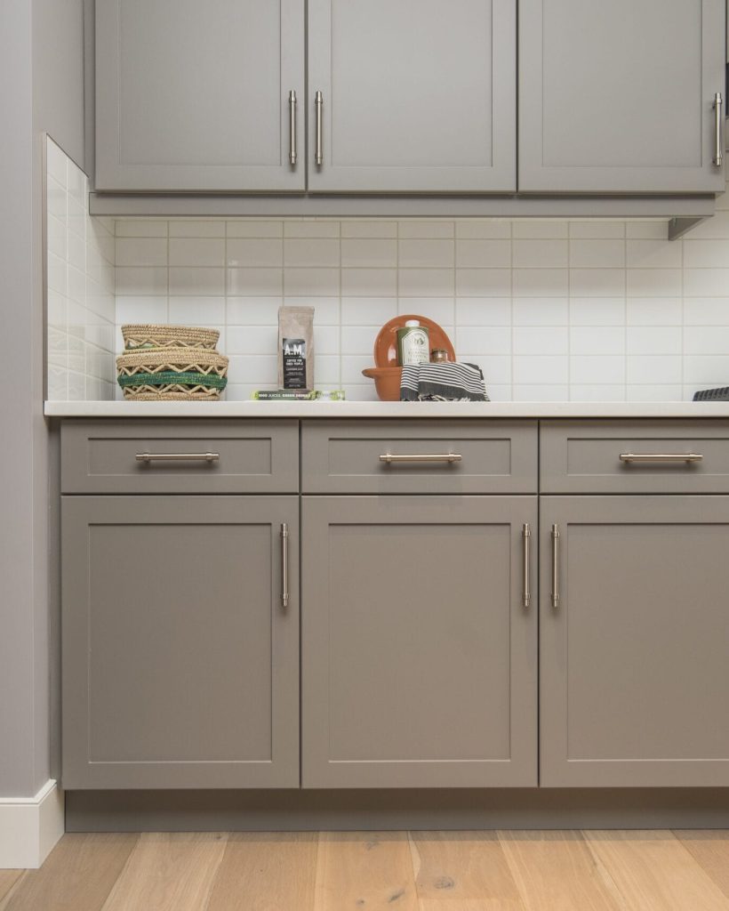 A beautiful shot of a modern house kitchen shelves and drawers